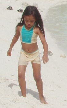 Hot feet! And a dark Shana on the white sand.